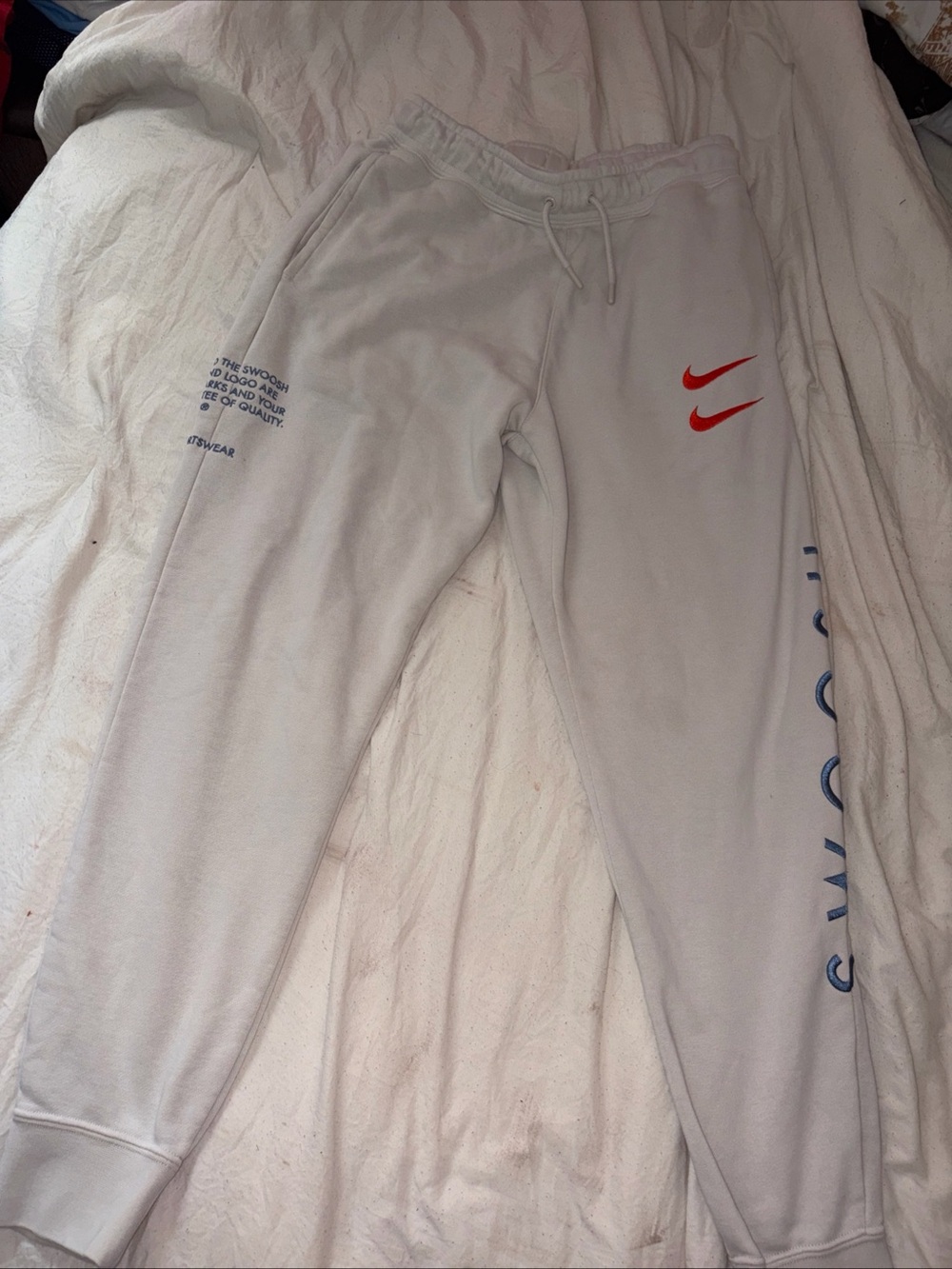 Nike White Sweatpants with Red Double Swoosh and Blue Leg Text